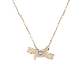 dameka: ribbon bow pendant pale gold/crystal